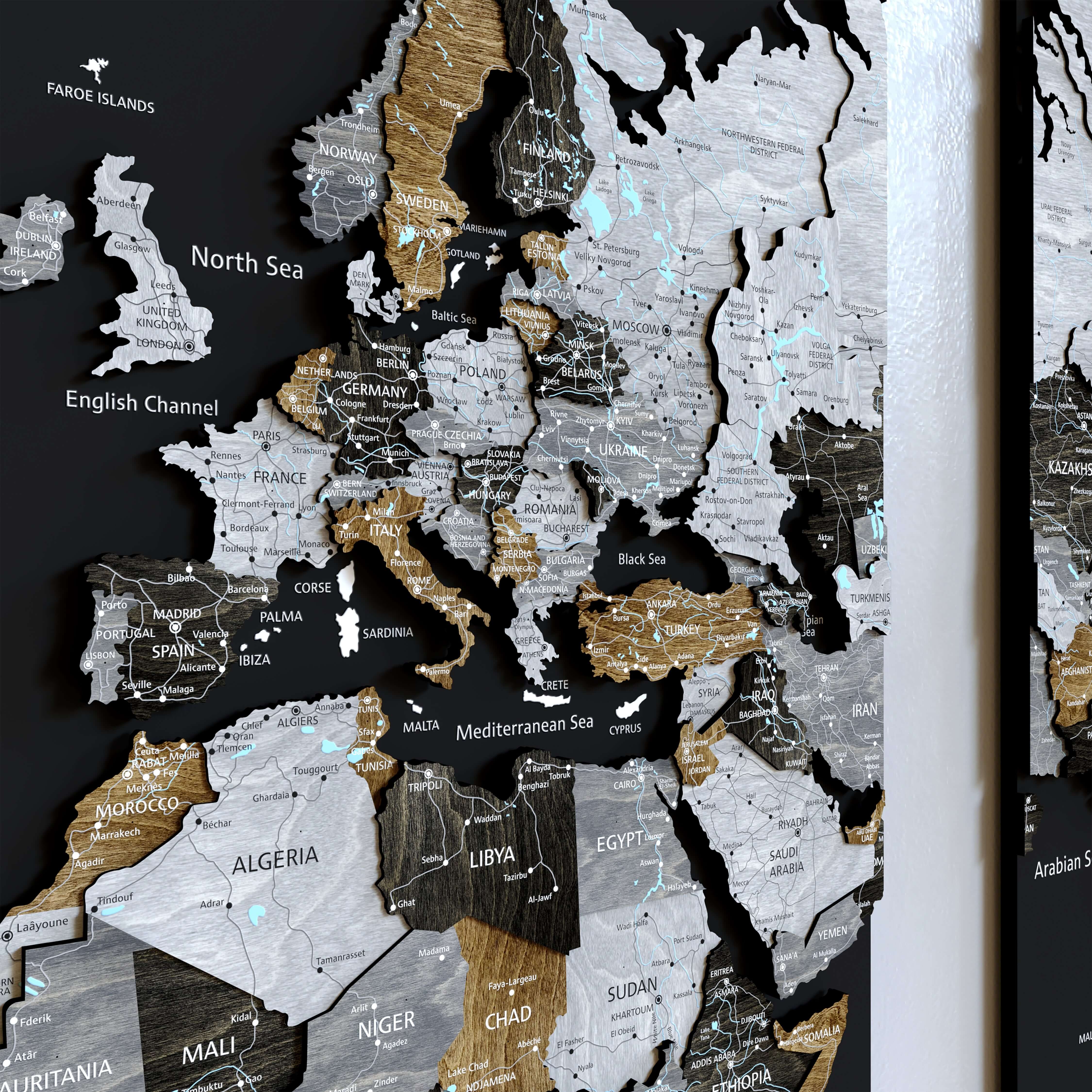 3D Wooden world maps on a board showcasing a detailed world map with various countries highlighted.