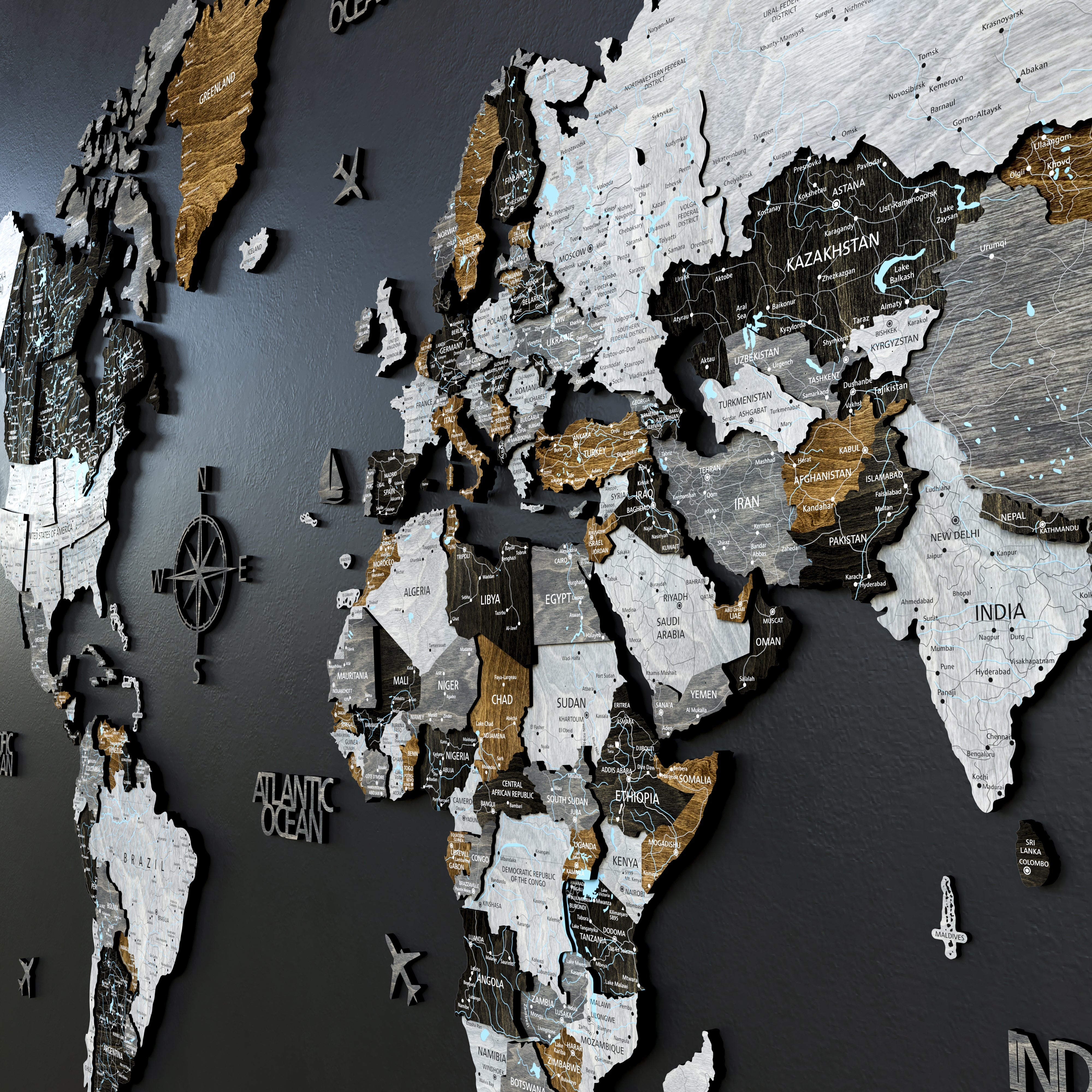 3D wooden world map in loft style with distinct elevation levels, showcasing a striking design on a dark wall.