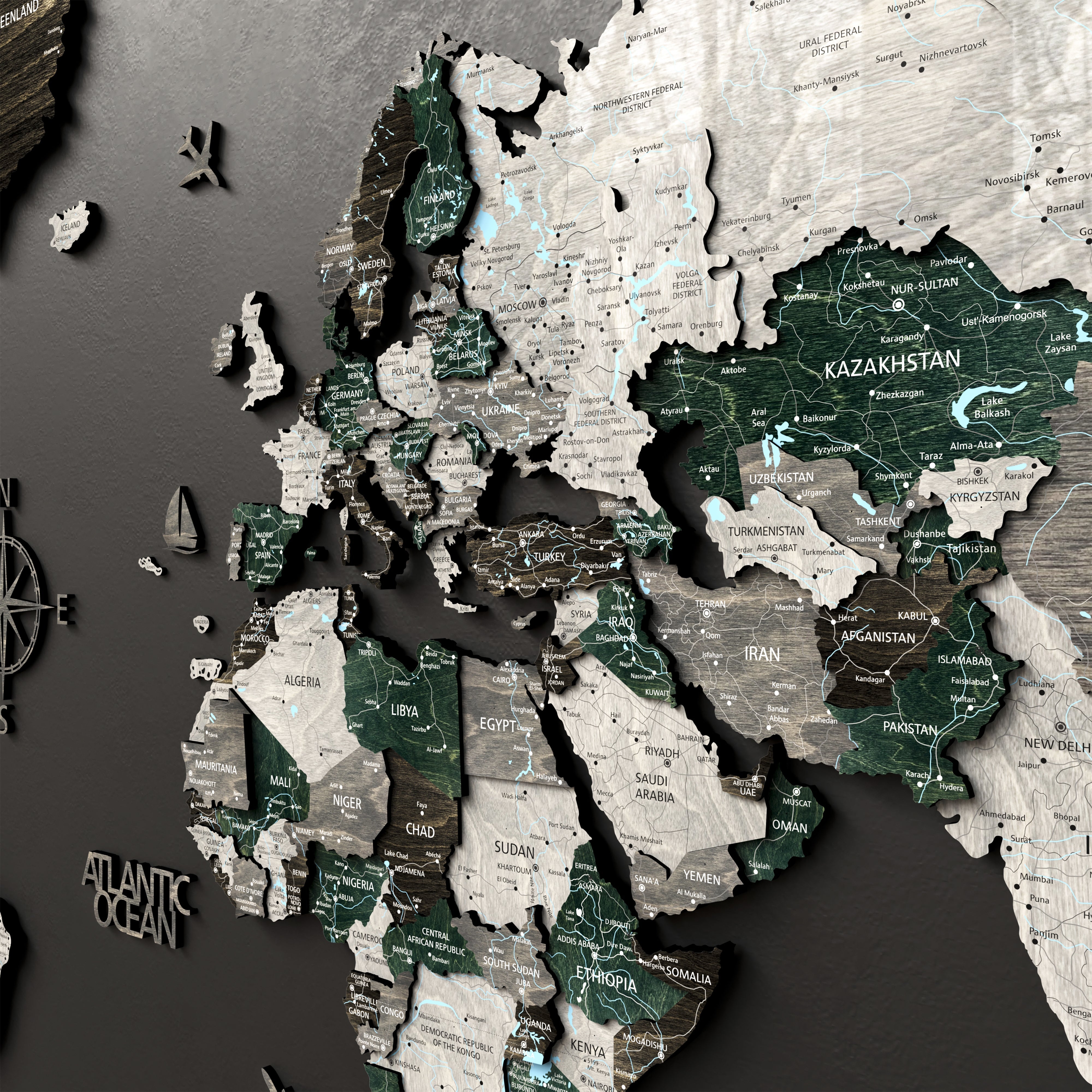 Detailed 3D wood world map decor showcasing Europe, Asia, and Africa with intricate designs.