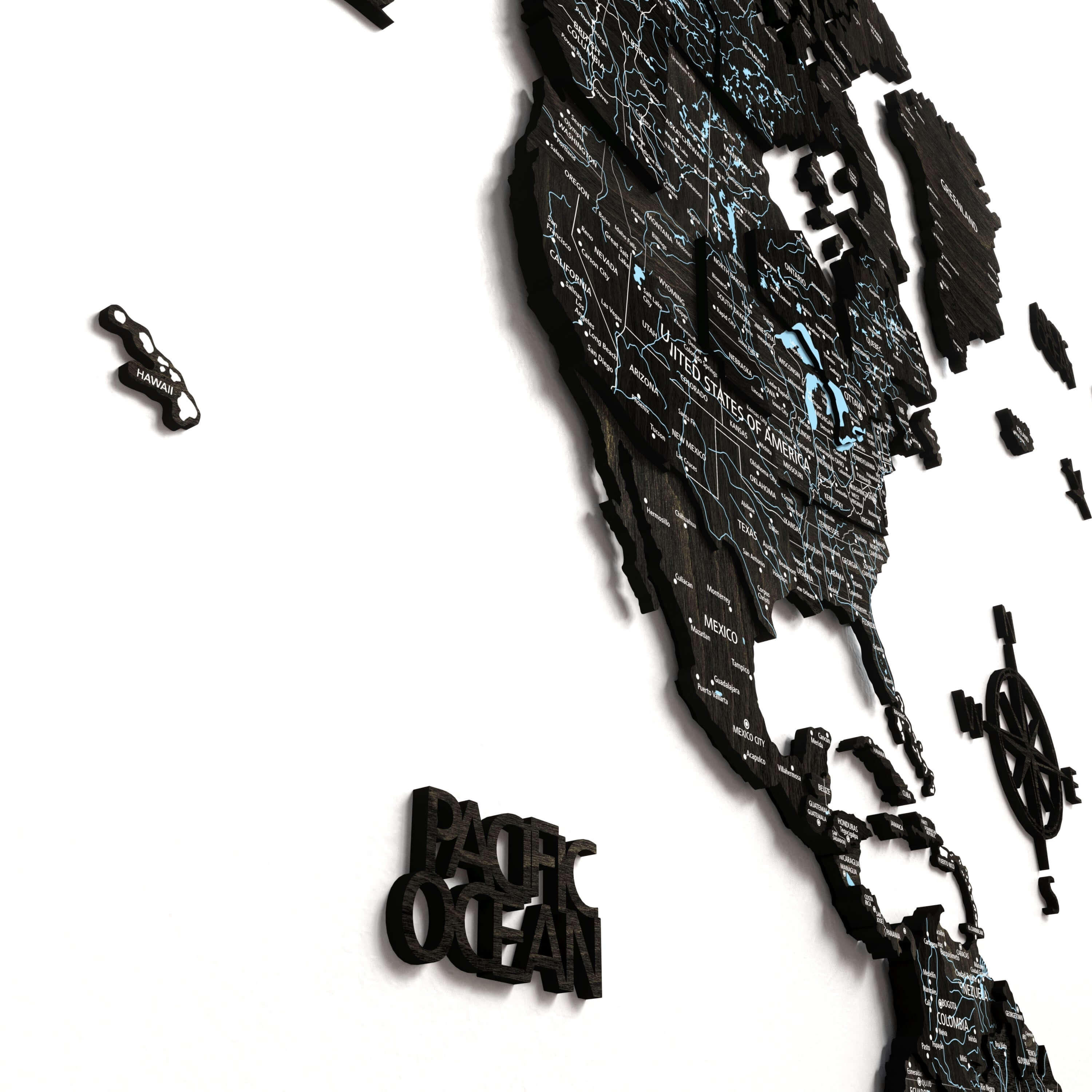 Close-up of the Black Wood World Map showcasing intricate details of countries and the Pacific Ocean.