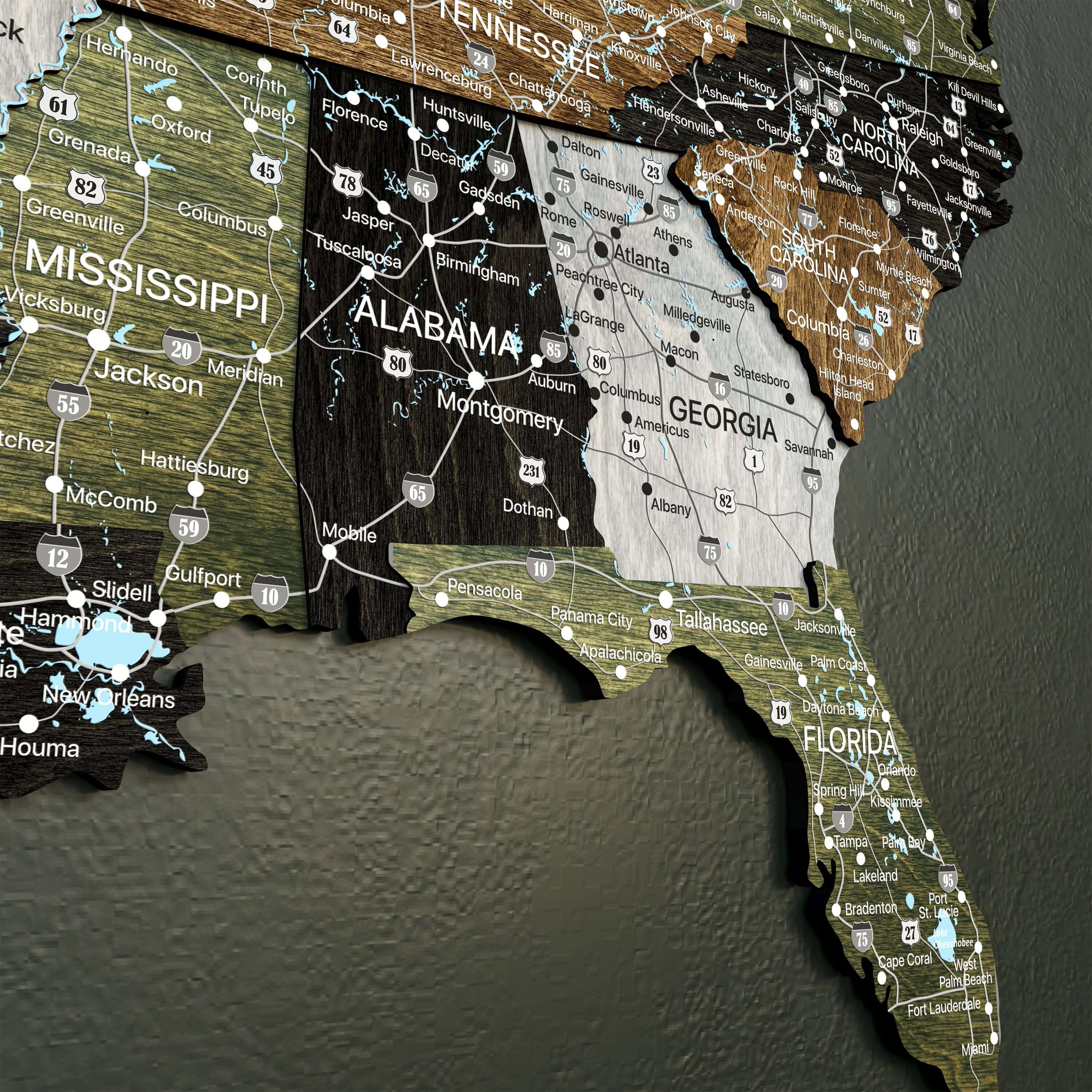 Rustic 3D wooden map of the Southeastern USA with state names and travel routes.