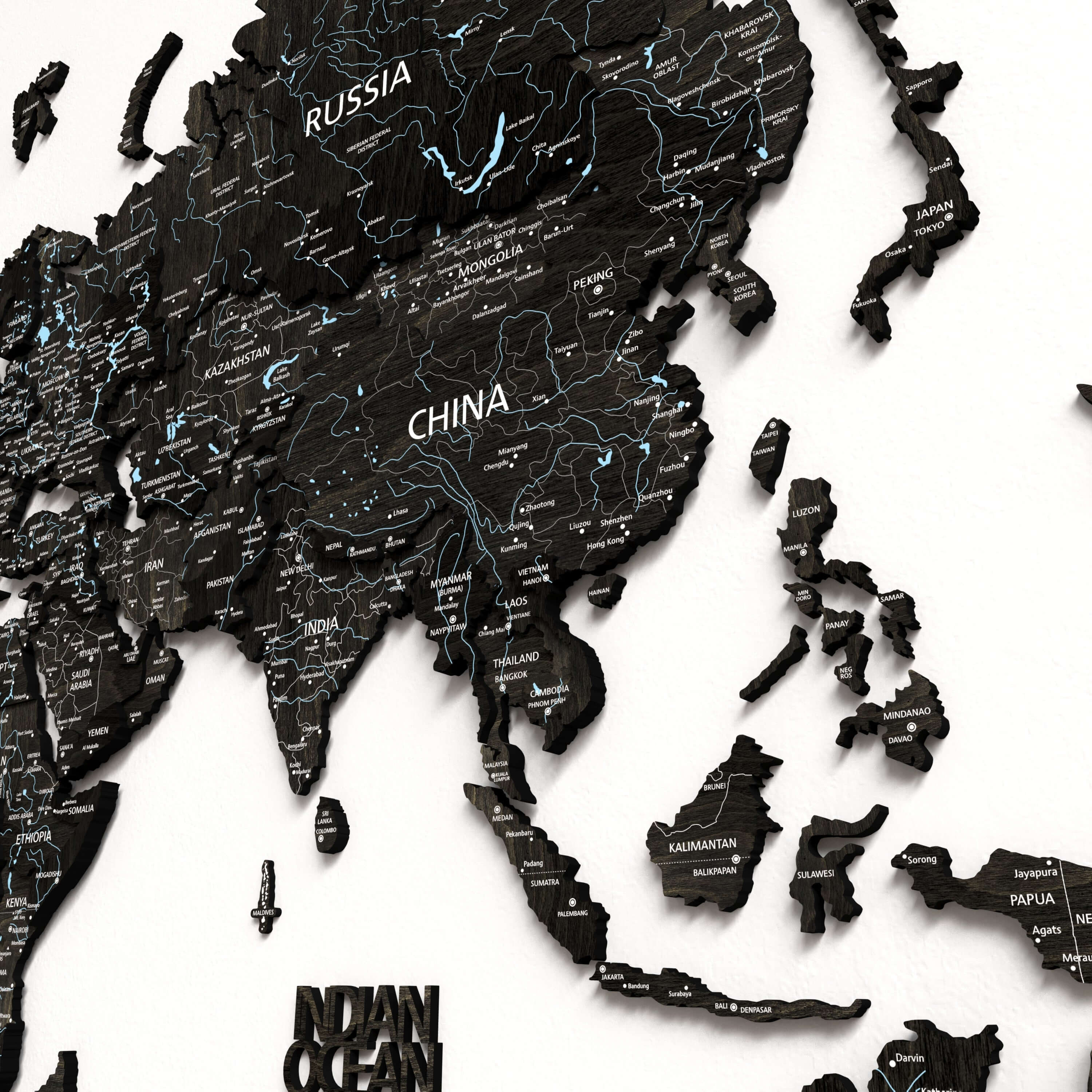 Black Wood World Map showcasing Asia with detailed country names and geographic features.
