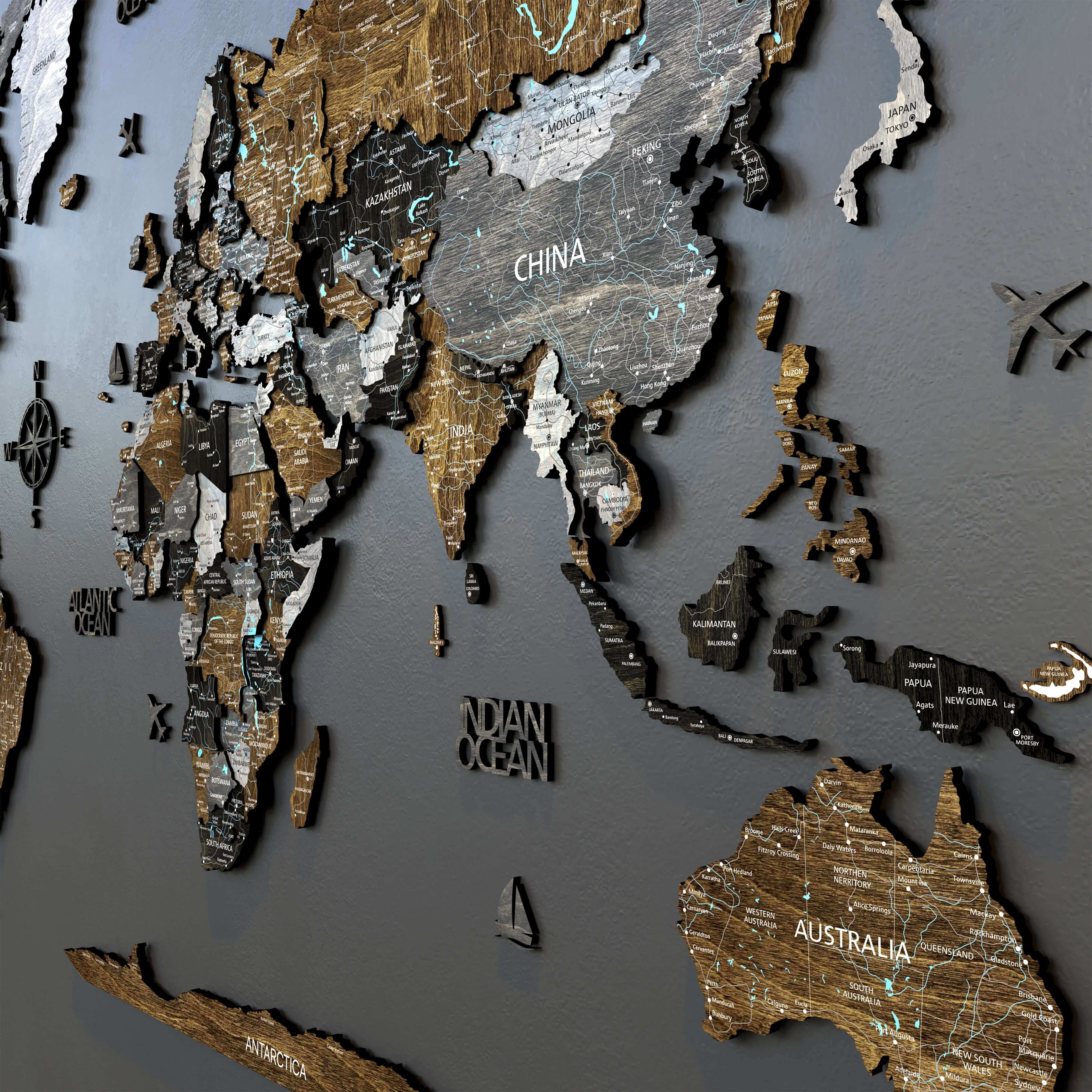 Wood world map in dark loft style with detailed countries and oceans, perfect home decor piece.