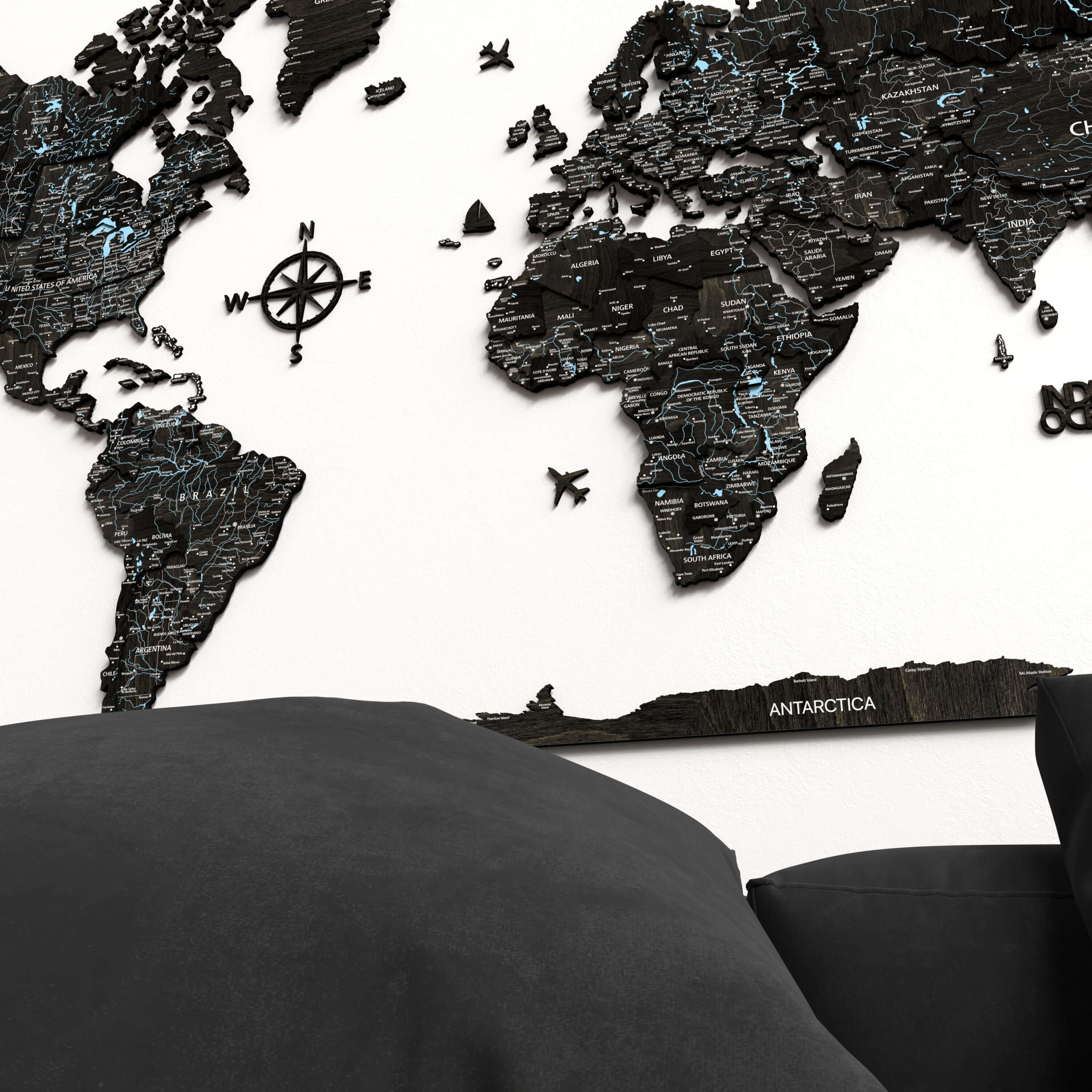 Black Wood World Map displayed on a wall, showcasing intricate details and a modern design for stylish home decor.