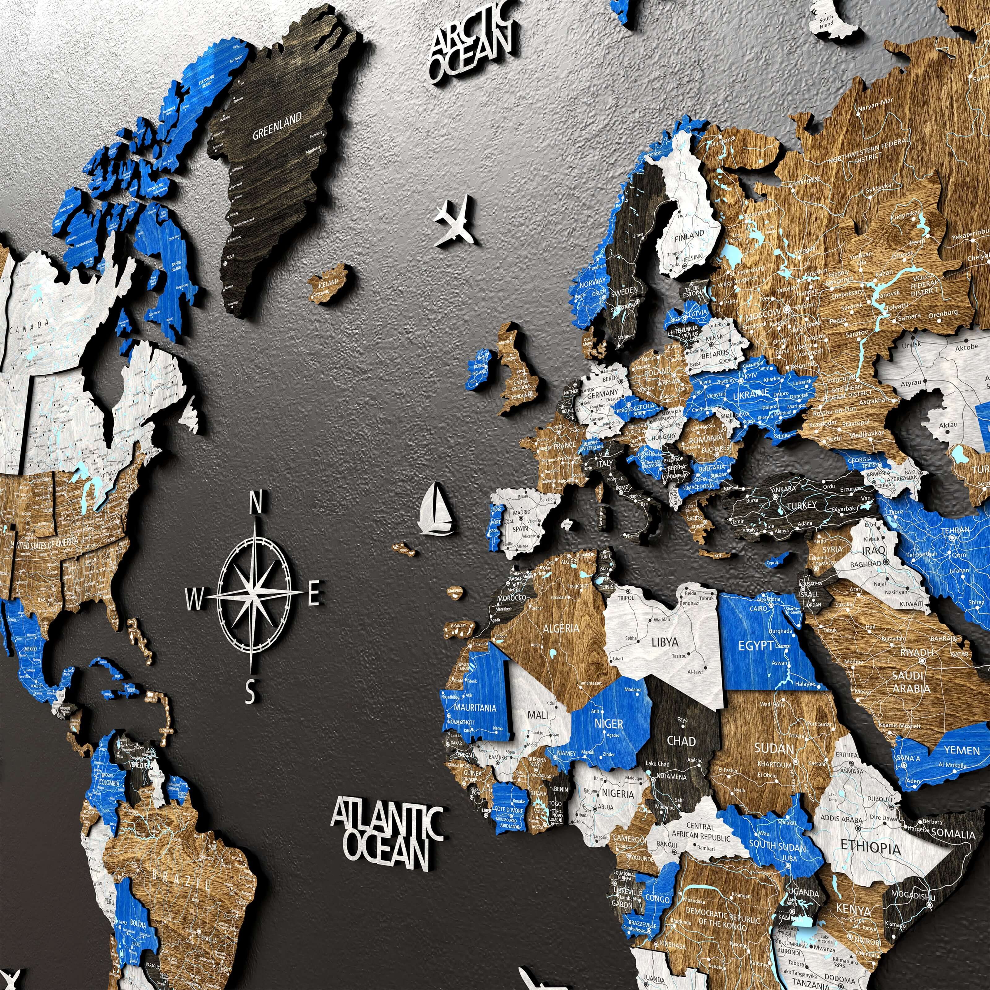 3D wooden world map featuring countries and oceans in blue and natural wood tones, with a compass rose design.