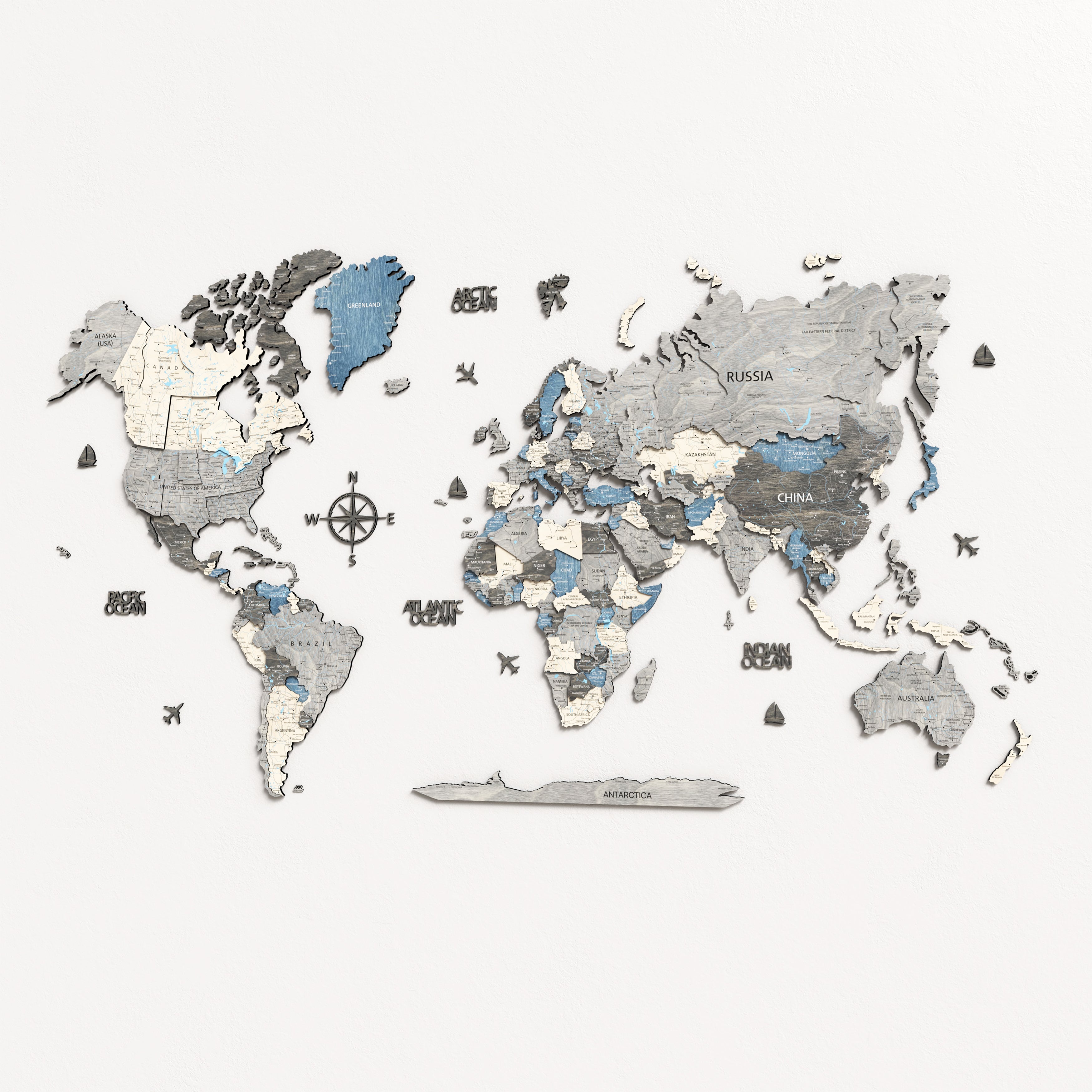 3D wooden world map featuring detailed countries in varying shades of blue and gray, handcrafted from premium plywood.