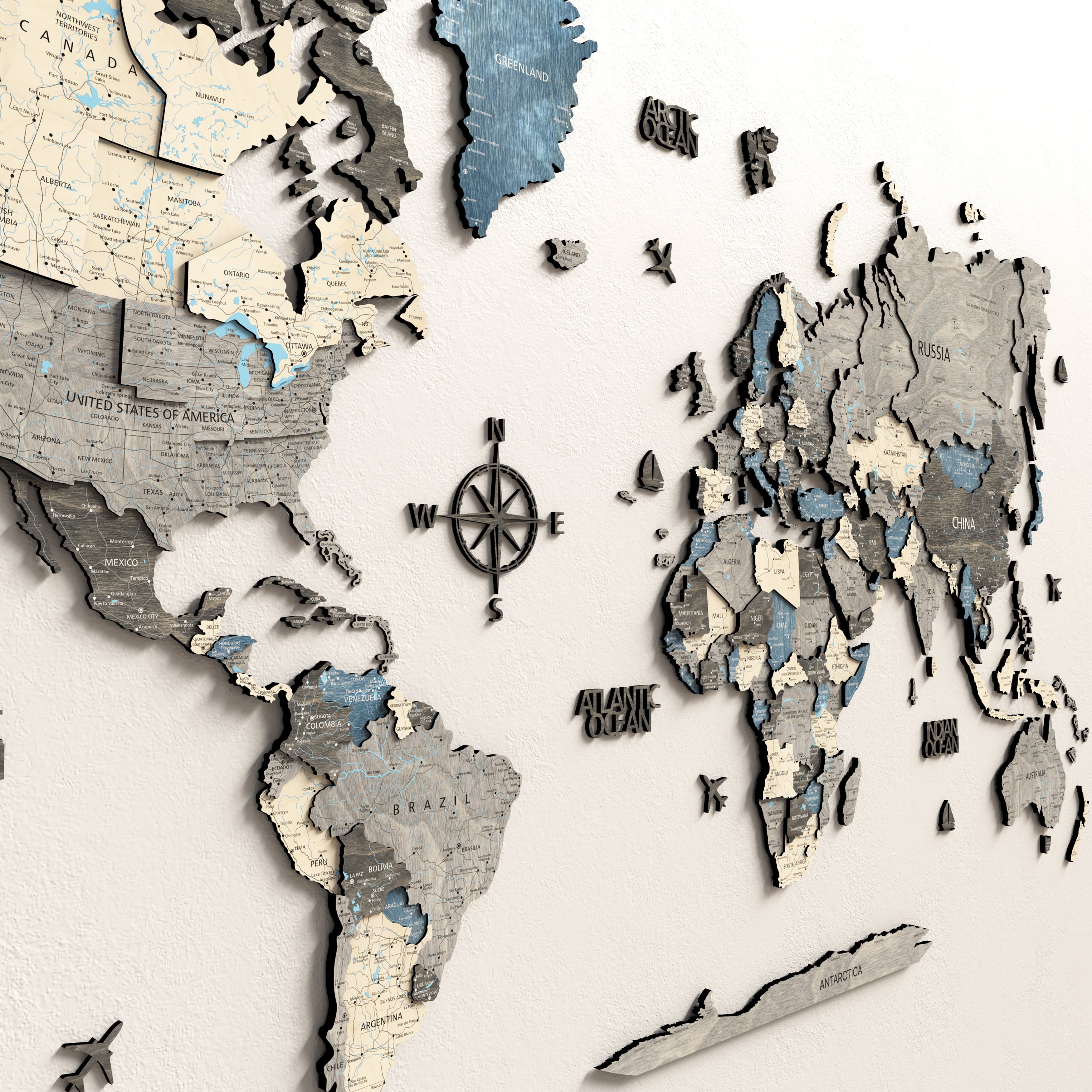 3D wooden world map featuring detailed continents and a compass, showcasing an artistic and educational home decor piece.