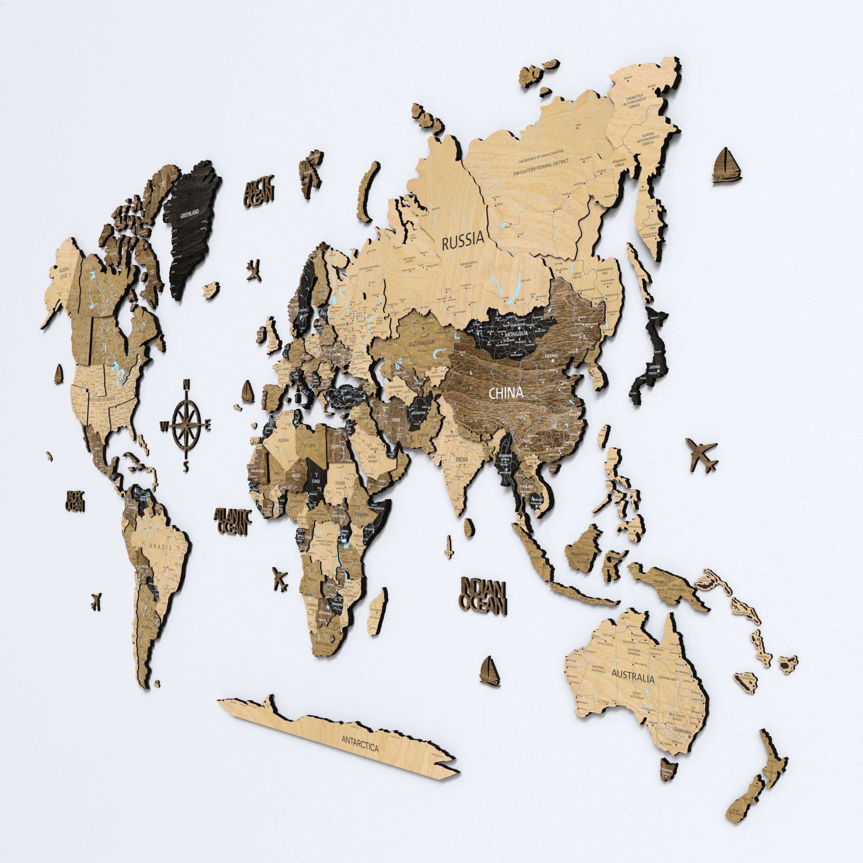 A beautifully lit space with a dark brown 3D wood world map hanging on the wall. The push pin map with printed countries serves as both a decorative piece and a functional travel tracker, ideal for modern home decor.